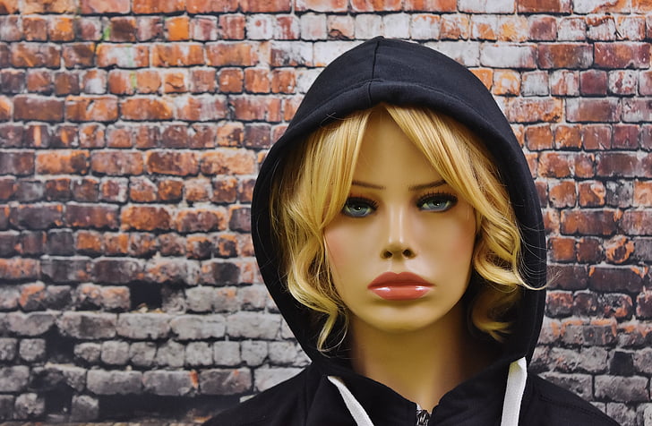female mannequin wearing black hoodie