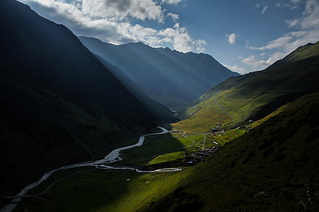 landscape photography of valley beside the mountains