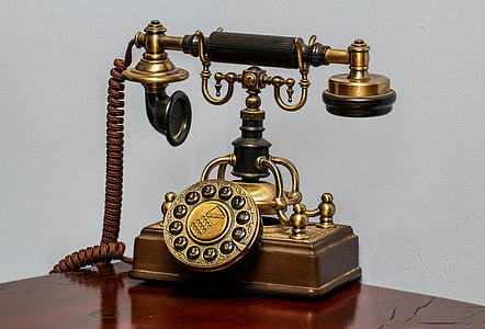 closeup photo of vintage brown rotary dial phoine