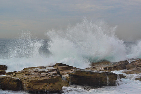 waves of water splashed on rock