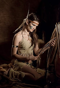 Native American woman holding dreamcatcher