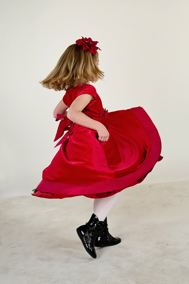 girl wearing red cap-sleeved midi dress