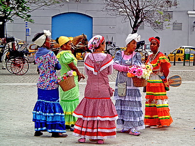 women holding baskets while standing during daytime
