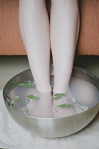 person doing foot spa
