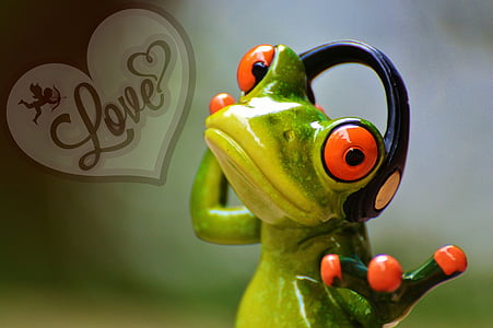 green and yellow frog wearing black headphone sticker