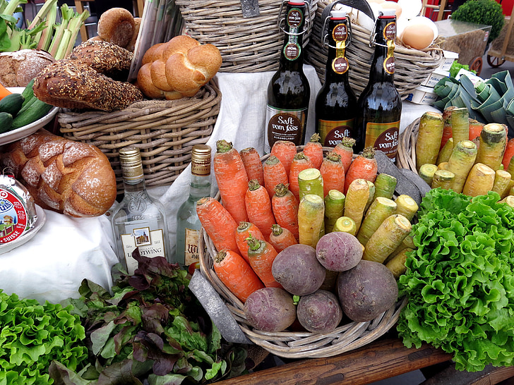 vegetables, pastries, and bottles on brown table