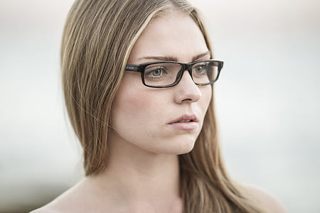 woman wearing clear eyeglasses with black frames