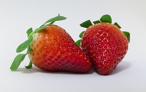 two strawberries in white background