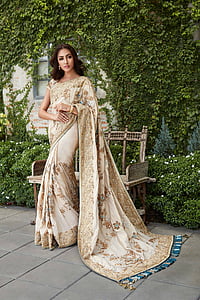 woman in brown floral sari traditional dress