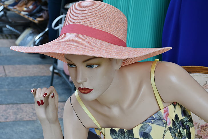 mannequin wearing pink hat