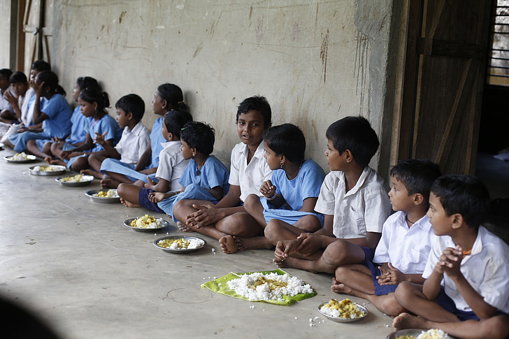 children's eating while sitting on floor during daytime