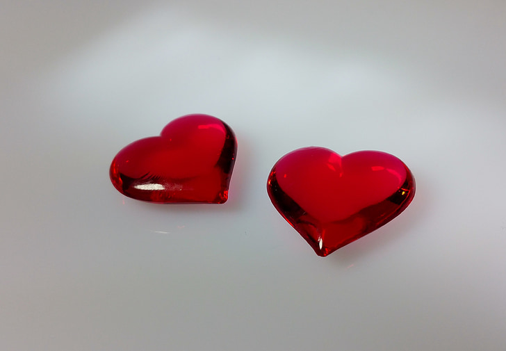 photo of two red heart gemstones