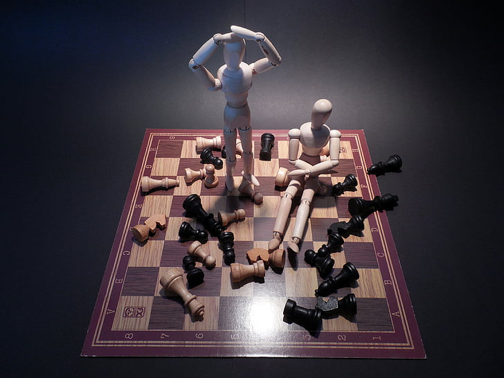 two puppets on chess board