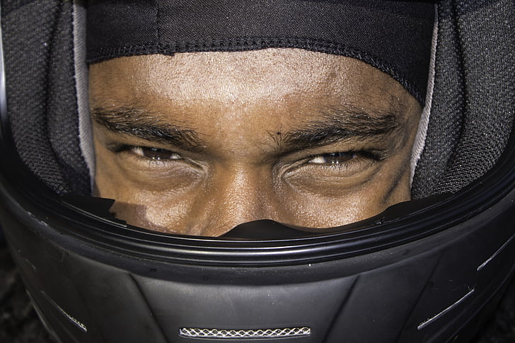 person wearing black helmet close-up photo