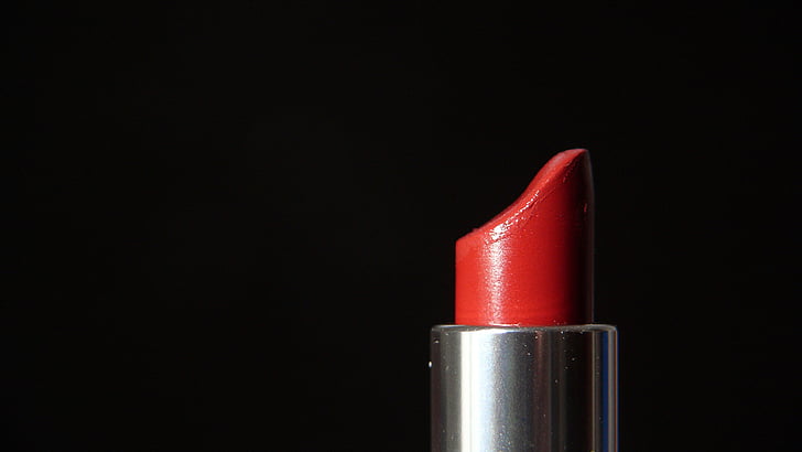 red lipstick in black background