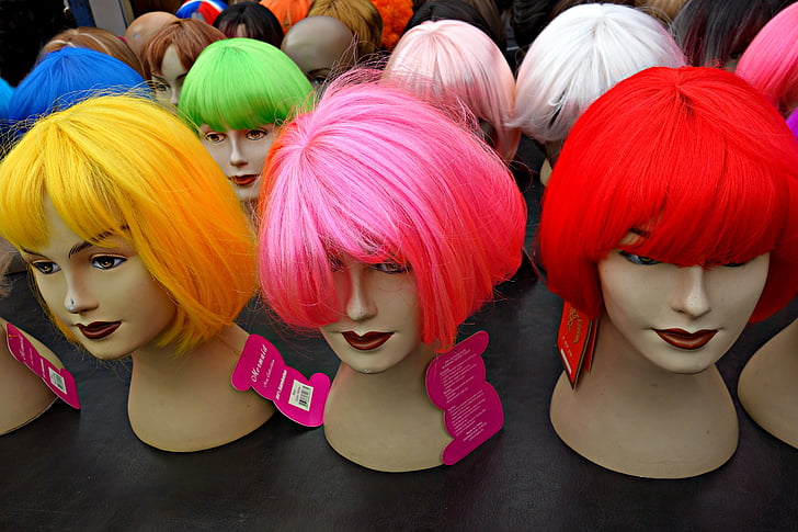 assorted-color wigs on table