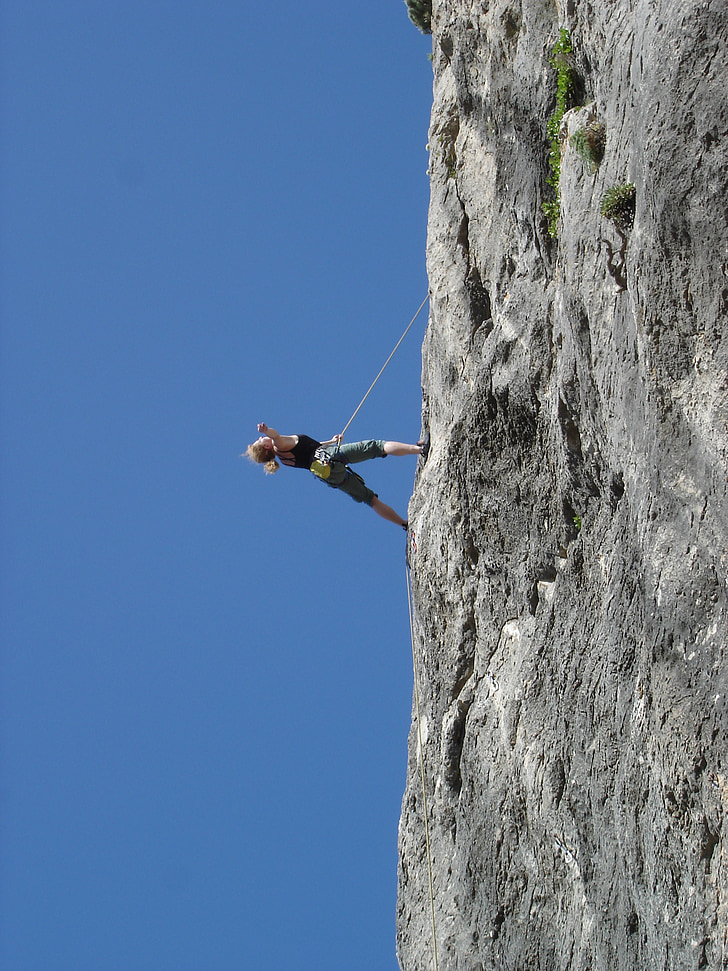 woman doing rock climbing