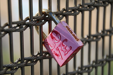 closeup photography of pink love printed padlock