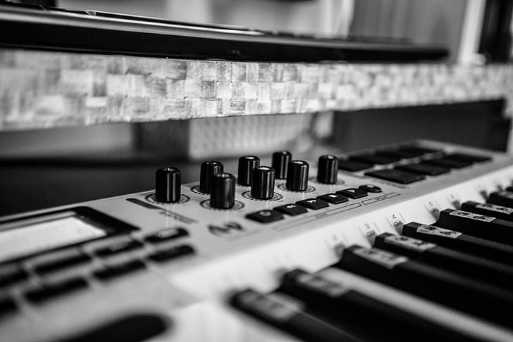 focus and grayscale photography of audio mixer