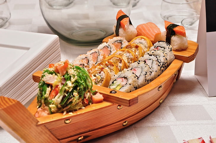 Royalty-Free photo: Brown wooden sushimi tray with sushis | PickPik