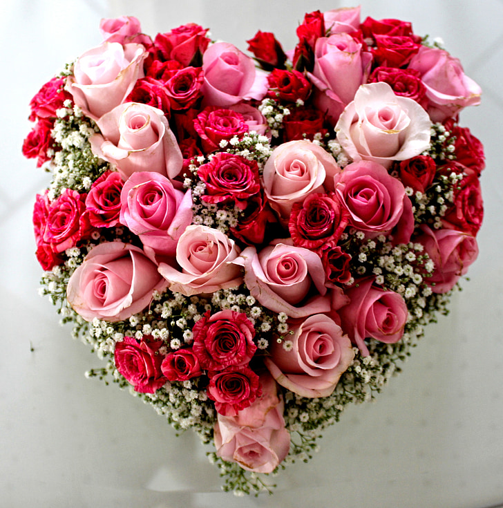 heart-shaped pink and red roses flower arrangement