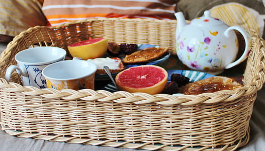 fruits and mugs on top of basket