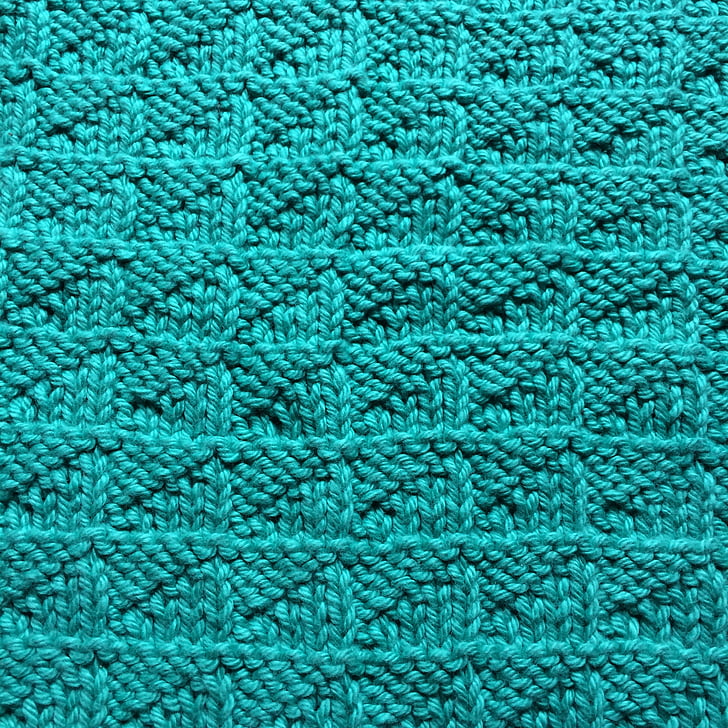 close-up photography of green knit textile