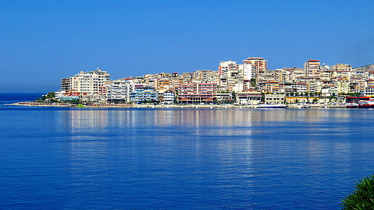 landscape photo of city buildings near on the body of water