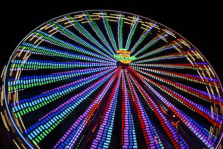 time-lapse photo of Ferris wheel with multicolored LED lights