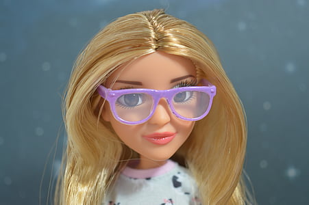girl with blonde hair doll wearing eyeglasses