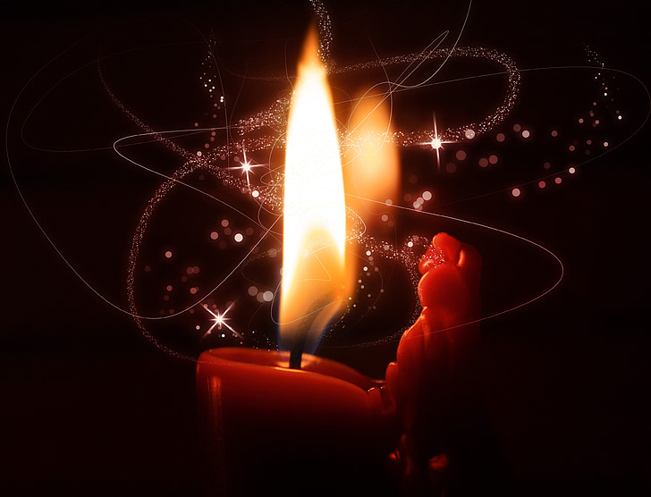 macro photography of lighted candle