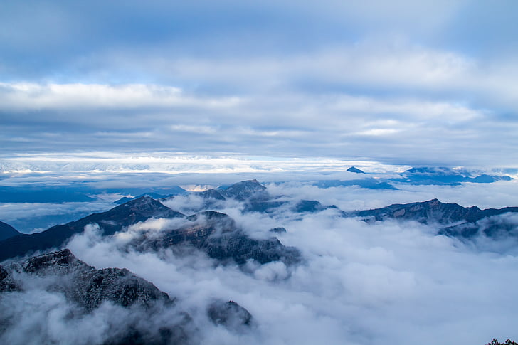 clouds over mountains overview photography
