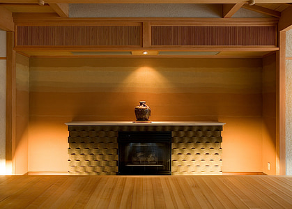 brown jar on fireplace