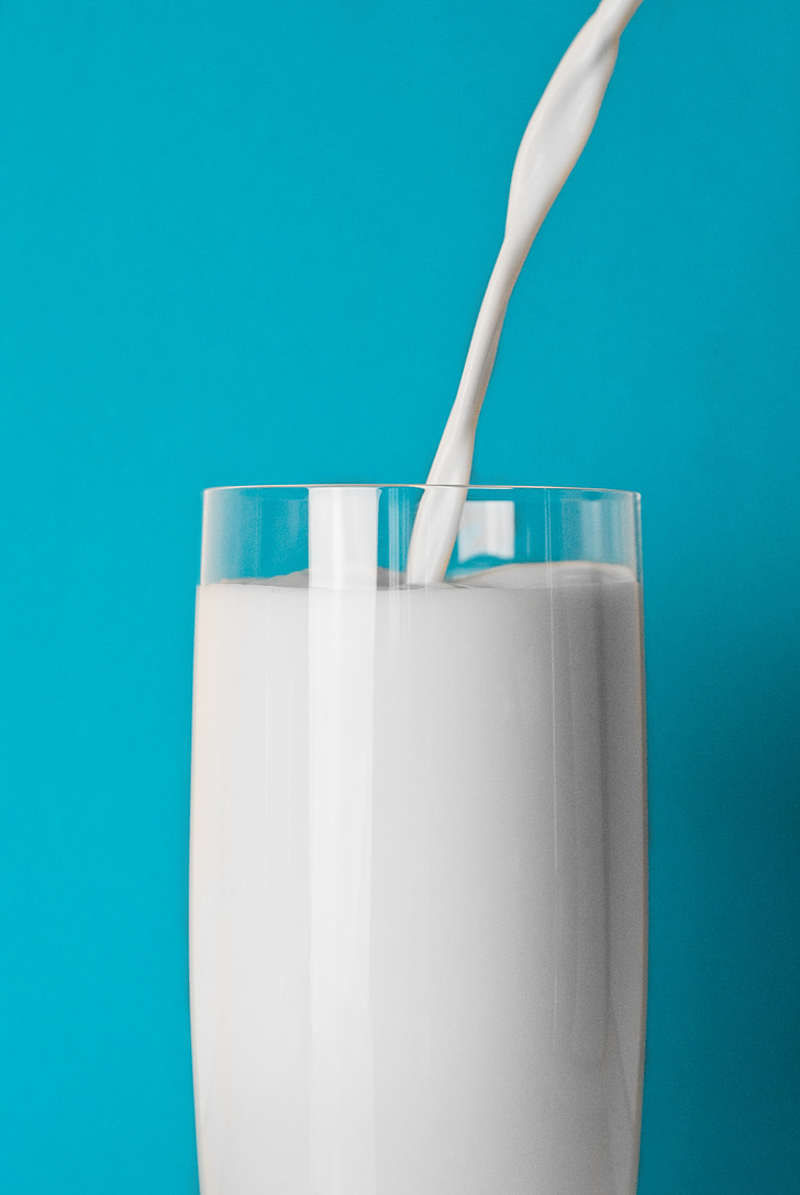 clear pint glass filled with milk