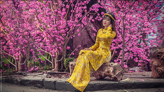 woman in yellow dress posing for photo