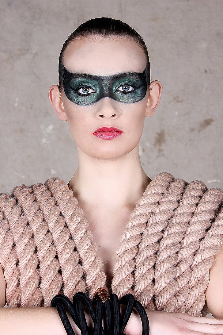 woman with black and gray mask makeup
