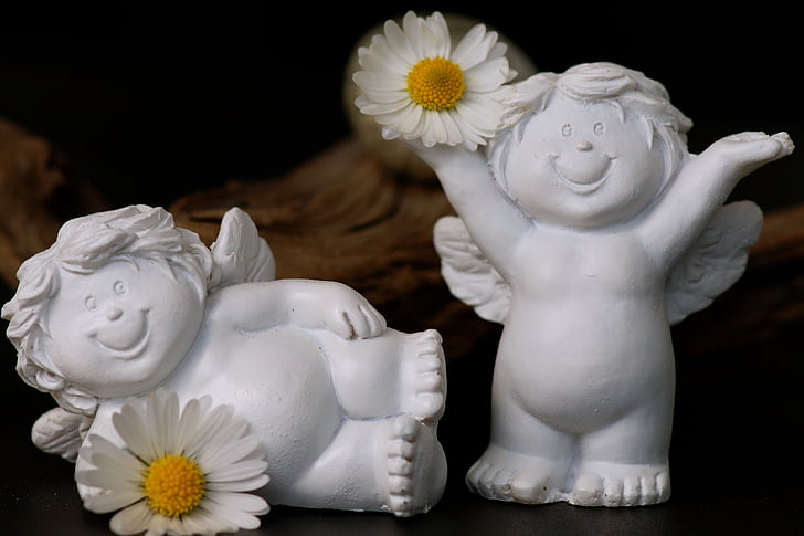 two white cherub figurines