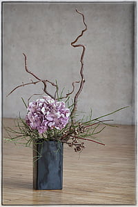 pink hydrangeas in black vase centerpiece