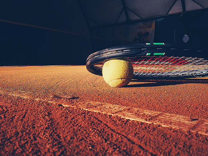 black Wilson tennis racket on surface