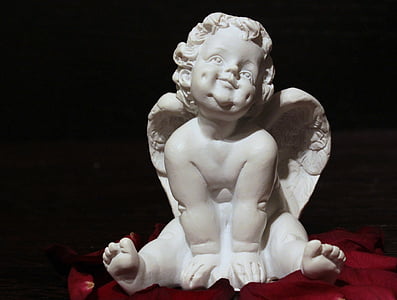 cherub smiling figurine