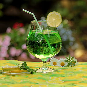 clear footed glass filled with green liquid