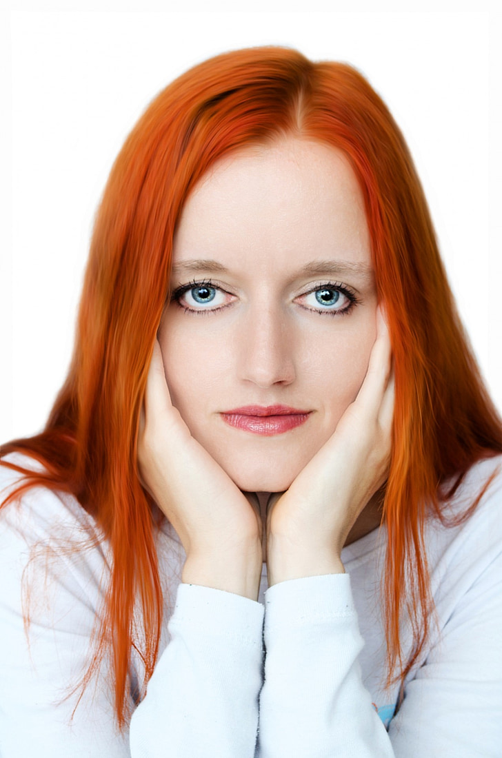 orange-haired woman in white long-sleeved shirt
