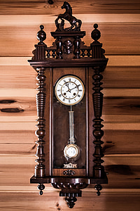 brown and white pendulum clock