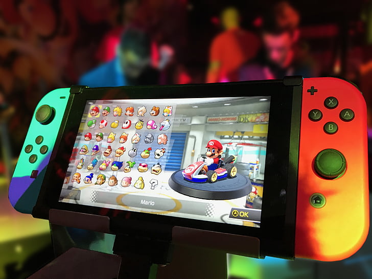 turned on Nintendo Switch with Joy-Con and Super Mario game display