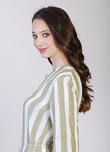 closeup photography of woman in gray and white striped top