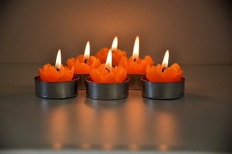 lighted orange tealight candles