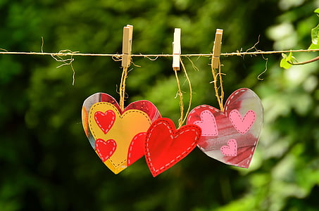 three pink-yellow-and-red heart decors