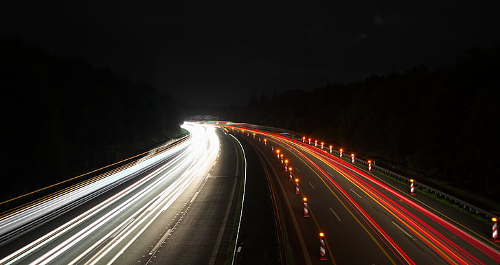 timelapse photography of traveling vehicles during nighttime