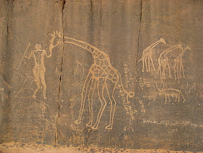 illustration of man feeding giraffes on wall