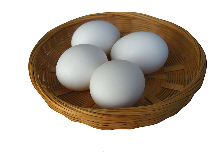 four eggs on round woven trey